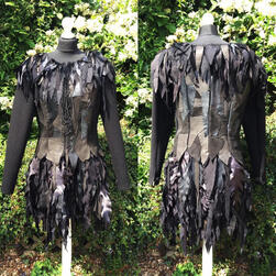 Rag dress with wool base, leather patchwork bodice, and 'feathers' made of various fabrics.